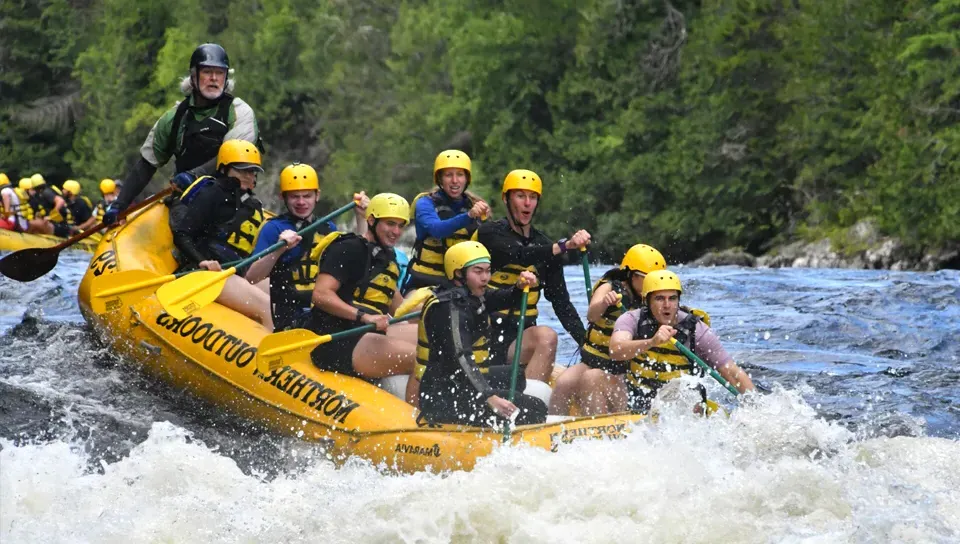 Graduate students white water rafting